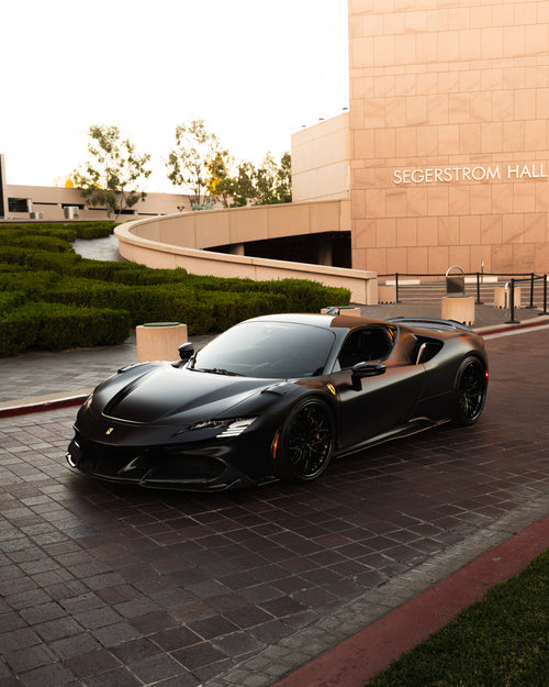 High end sports car protected with satin black paint protection film